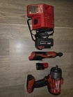 Milwaukee Impact Wrench & Ratchet Set, Li-ion, 18V/12V, Batteries, Red/black Used. Price: $320.00.